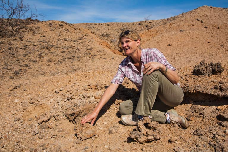 Louise Leakey examining fossils (Photo credit- Lorna Buchanan-Jardine)