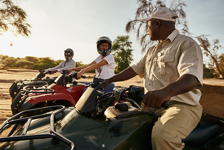 Quad biking to the local village on this family safari holiday with The Safari Collection